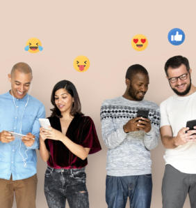 happy diverse people using digital devices