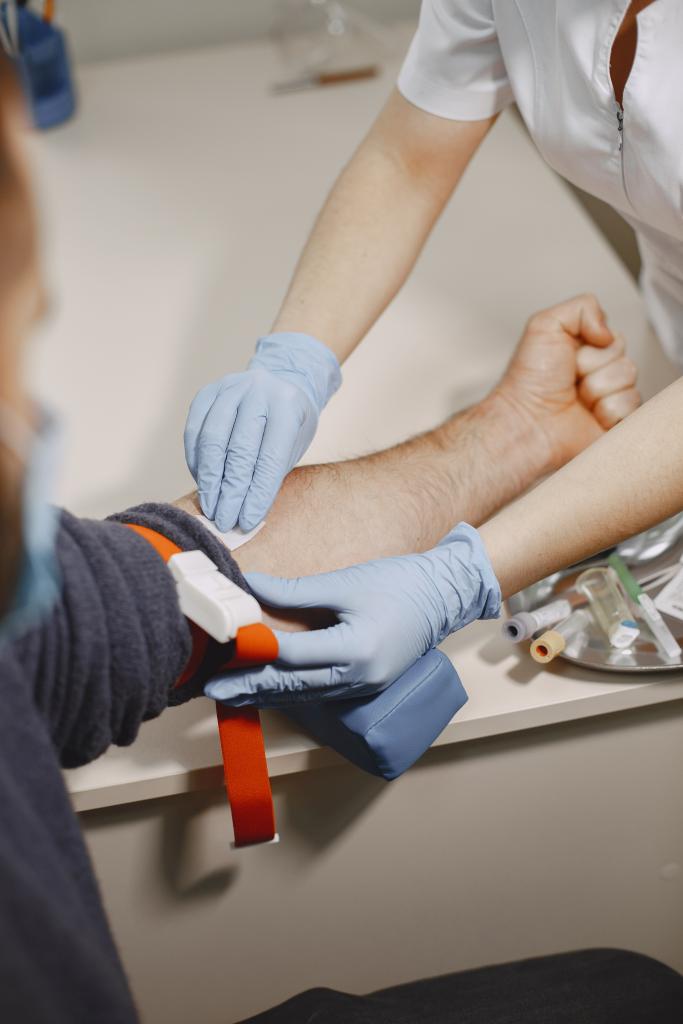 skillful nurse is doing blood test man clinic man medical mask