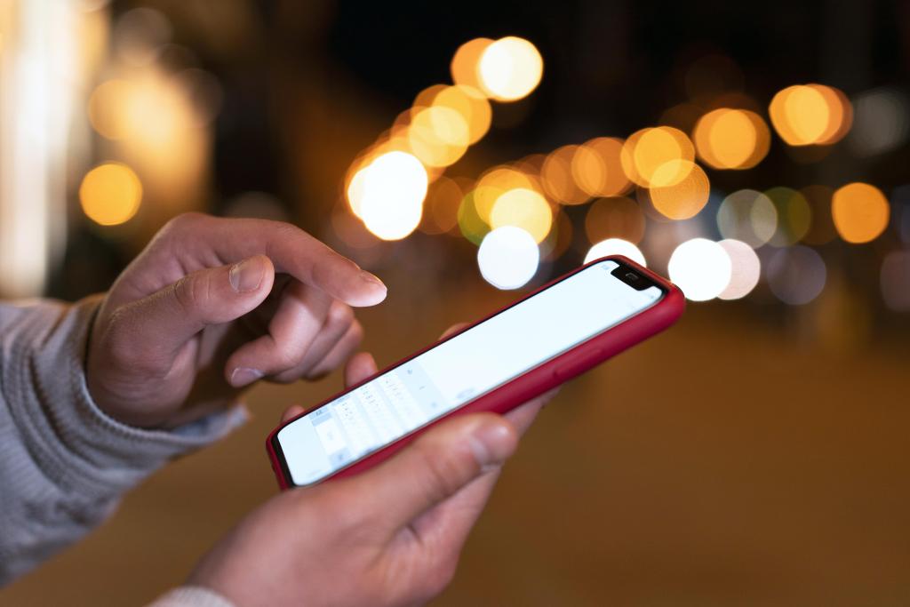 close up hand holding smartphone